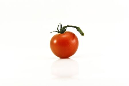 Close Up of cherry tomatoes on the vine in white backgroundの写真素材