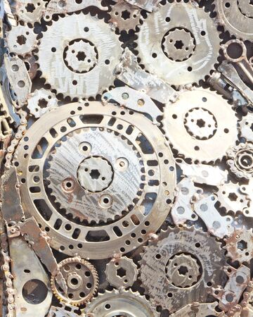 Distressed interlocking metal gears.