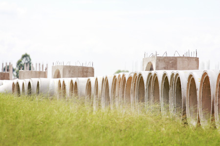 Some concrete tubes in the ground. Construction conceptの写真素材