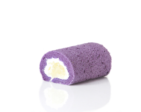 Purple roll cake on white backgroundの写真素材