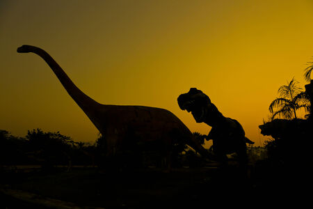 silhouettes of dinosaurs.の写真素材