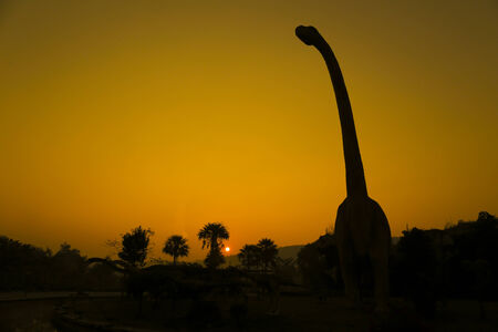 silhouettes of dinosaurs.の写真素材
