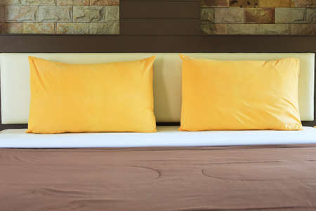 Bed and Pillows with warm glow.