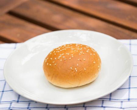 bread with sesame seeds on white plate.
