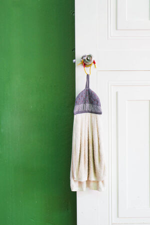 dirty rag  hanging on the door.の写真素材
