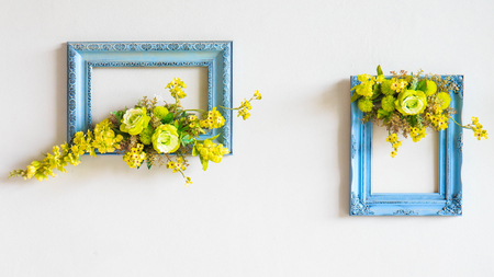 Artificial flowers frame on wall.の写真素材