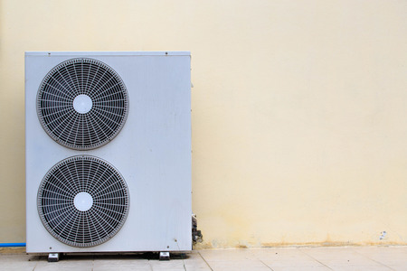 Close up air conditioner heating units installation outside of building.の写真素材