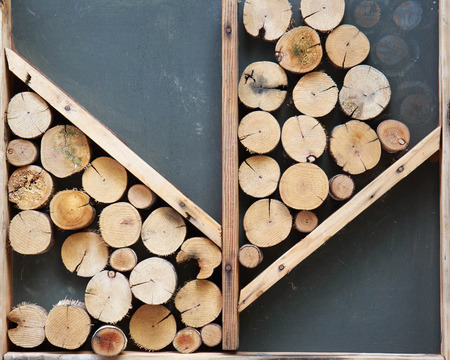 Cutting wood is arrange to be the frame wall.の写真素材