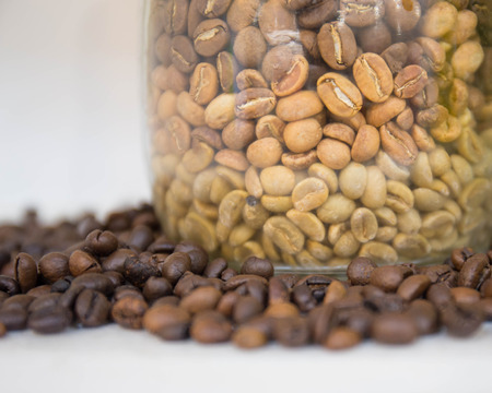 coffee beans in a bottle isolated on a white background.の写真素材