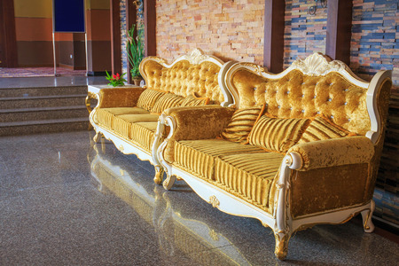 Beautiful vintage sofa next to wall.のeditorial素材