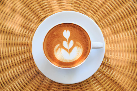 Cup of art latte or cappuccino coffee.