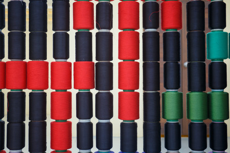 Row of colorful sewing thread.の写真素材
