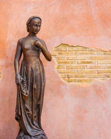 Female statue with grunge wall.の写真素材