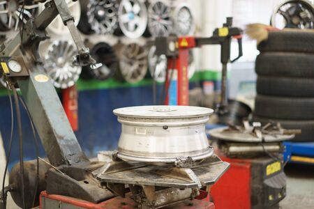 Mechanic is changing car tire.の写真素材