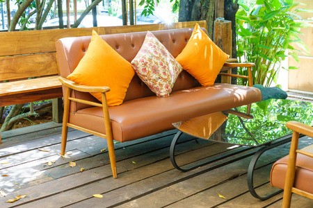 Vintage sofa with the colorful pillows.の写真素材