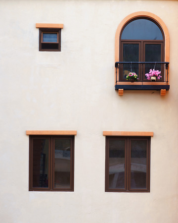 Vintage window on orange cement wallの写真素材