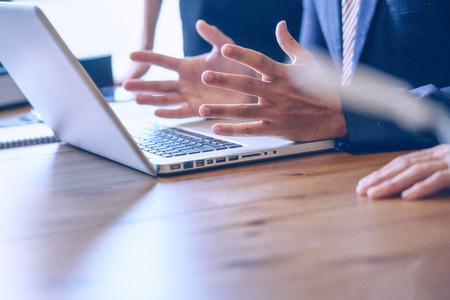 Businessman working with modern laptop in office.の写真素材