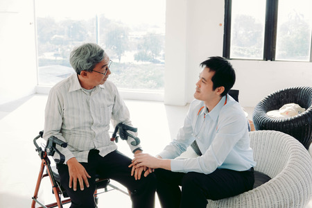 Old man and doctor at hospital.