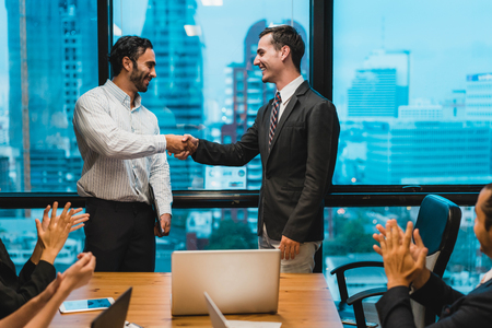 Businessman and partnership shaking hands in conference room. Business people shaking hands agreement concept.の写真素材