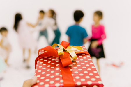 Close up gift bow on hand preparing for the children.の写真素材