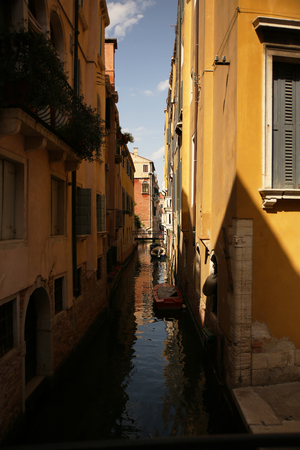 Cute Narrow Water Canal in Venice, Italyの写真素材