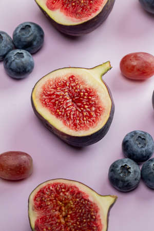 Flat lay top view pattern Fresh exotic fruit on beautiful purple background. Soft shadowの写真素材