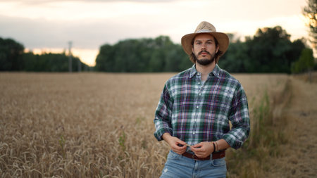 Portrait of the joyful happy caucasian man farmer in a hat looking and smilingの写真素材