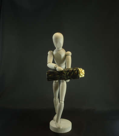 mannequin with box on the black backgroundの写真素材