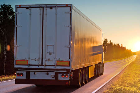 Truck on wood road in the evening