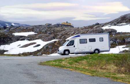 Caravan van on high-mountainous road of Norwayの写真素材