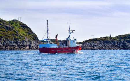 Fishing boat in a fjord of northern Norwayの写真素材