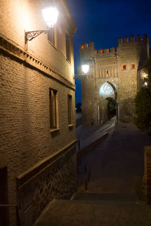 Night view of the gate in Toledoの写真素材