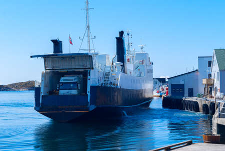 Truck on the ferry departs from the pierの写真素材