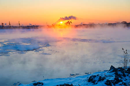 The winter lake sunrise landscape.の写真素材