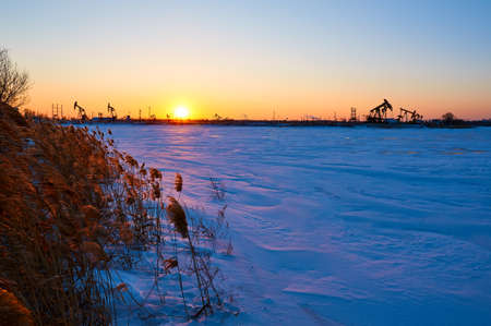 The winter lake snow sunset scenicの写真素材