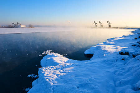 The beautiful snow of winter lakeside in the oil fields.の写真素材