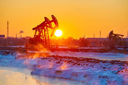 The oil fields sunrise landscape.の写真素材