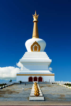 The white pagoda in blue sky and white clouds.の写真素材