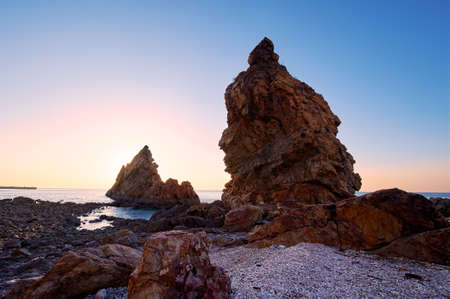 The landscape of coast sunrise of Dalian Bay, China.の写真素材