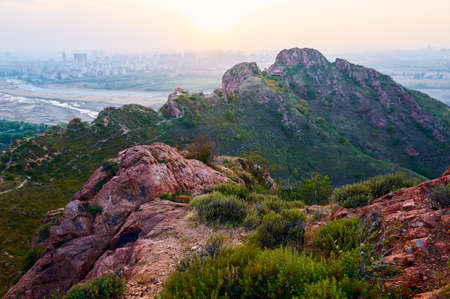 The red mountains sunset of Chifeng city of China.