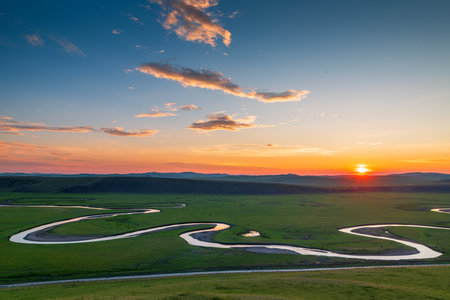 Beautiful sunset in the grasslands of Mongolia. View from above.の写真素材