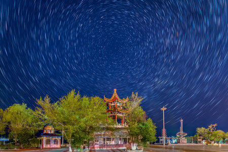The Square by the Riverbank of Nenjiang River in Nenjiang City, Heihe City, Heilongjiang Province, China, features a starry sky and a star.の写真素材