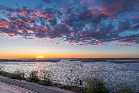 The sunset scenery of Nenjiang River in Nenjiang City, Heihe City, Heilongjiang Province, China.の写真素材