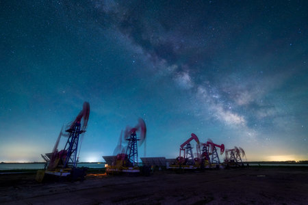 Pumping units under the starry sky at Daqing Oilfield, Daqing, Heilongjiang Province, Chinaの写真素材