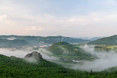 Mountain landscape with fog in the morning. View from the mountain top.の写真素材