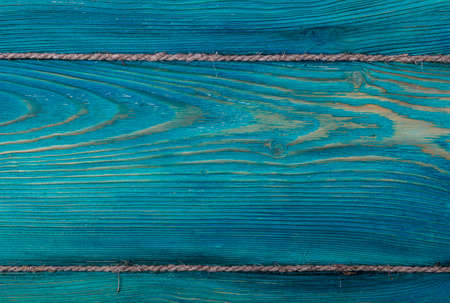 blue wooden texture background with old ropeの写真素材