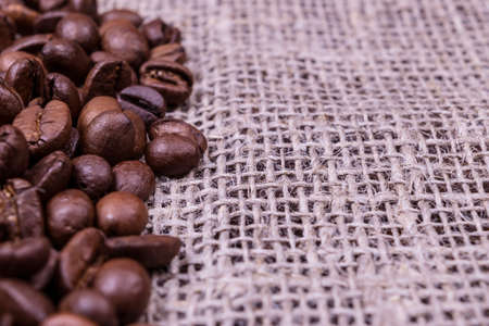 Burlap texture background with coffee beansの写真素材