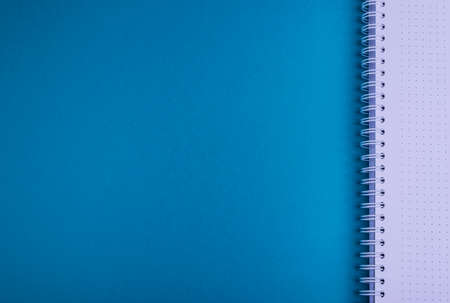 Notebook, blue background texture, empty spaceの写真素材