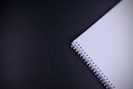 notebook on black background textureの写真素材