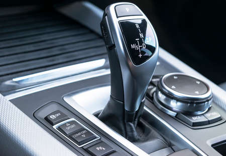 automatic gear stick of a modern car, car interior details